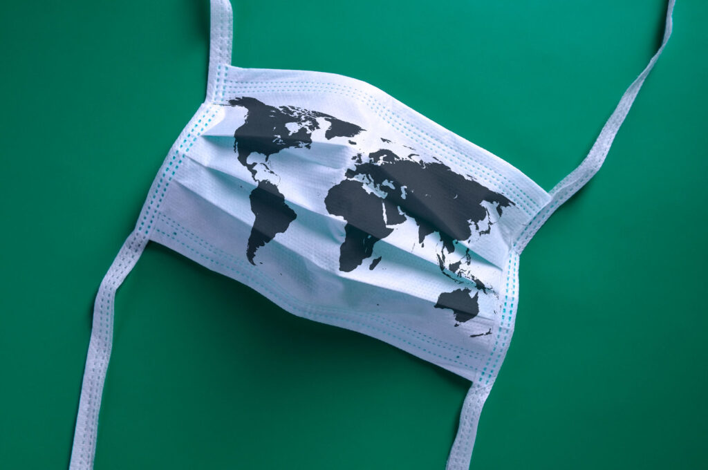 Mask with map of the world printed on it